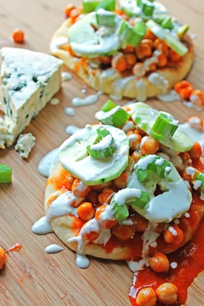 Buffalo chickpea flatbreads with cucumbers, celery, and blue cheese drizzle