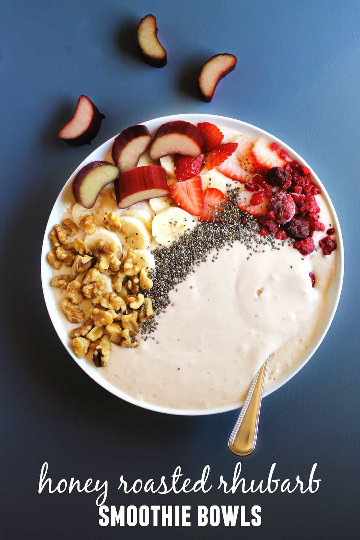 Honey roasted rhubarb smoothie bowls recipe! Tart rhubarb is roasted in sweet honey, then blended with yogurt and topped with all the smoothie bowl fixins. Such a healthy and beautiful breakfast! Vegetarian, gluten free, refined sugar free.