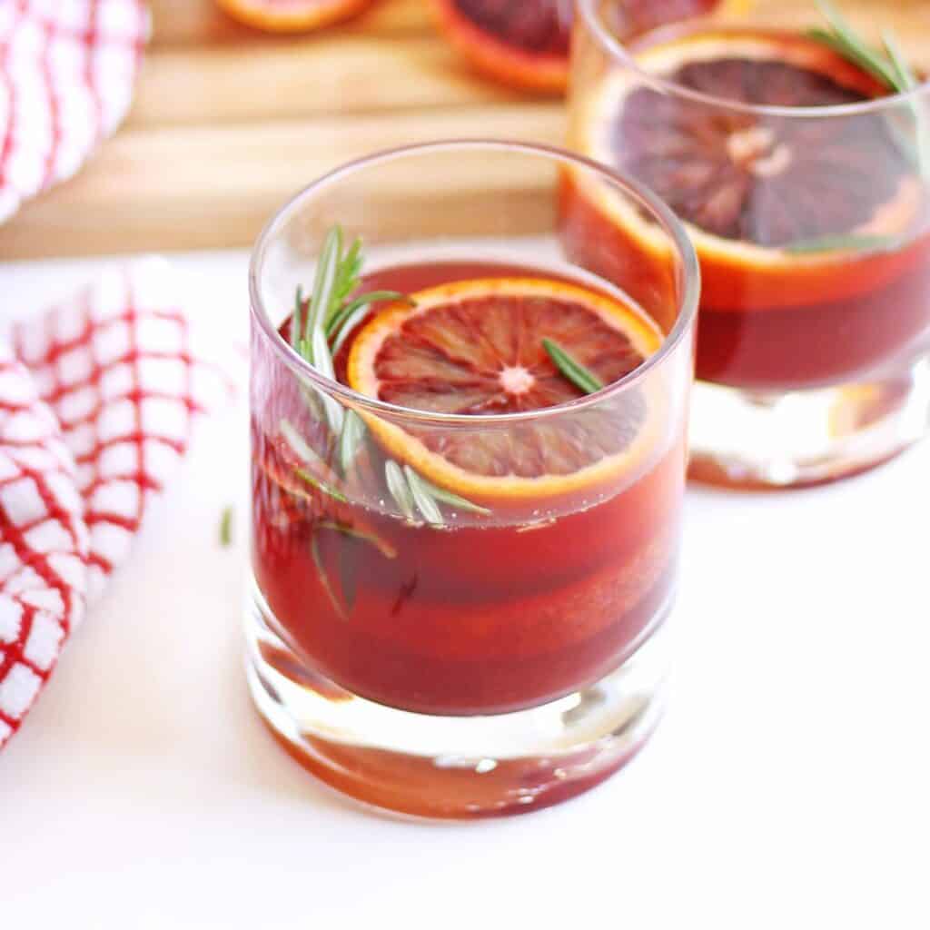 Delicious blood orange cocktail with gin and rosemary Rhubarbarians