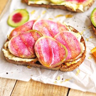 Bright and springy watermelon radish toast with orange mascarpone and honey recipe! Peppery radishes, mascarpone whipped with orange zest, and sweet honey. The perfect farmers market lunch! // Rhubarbarians