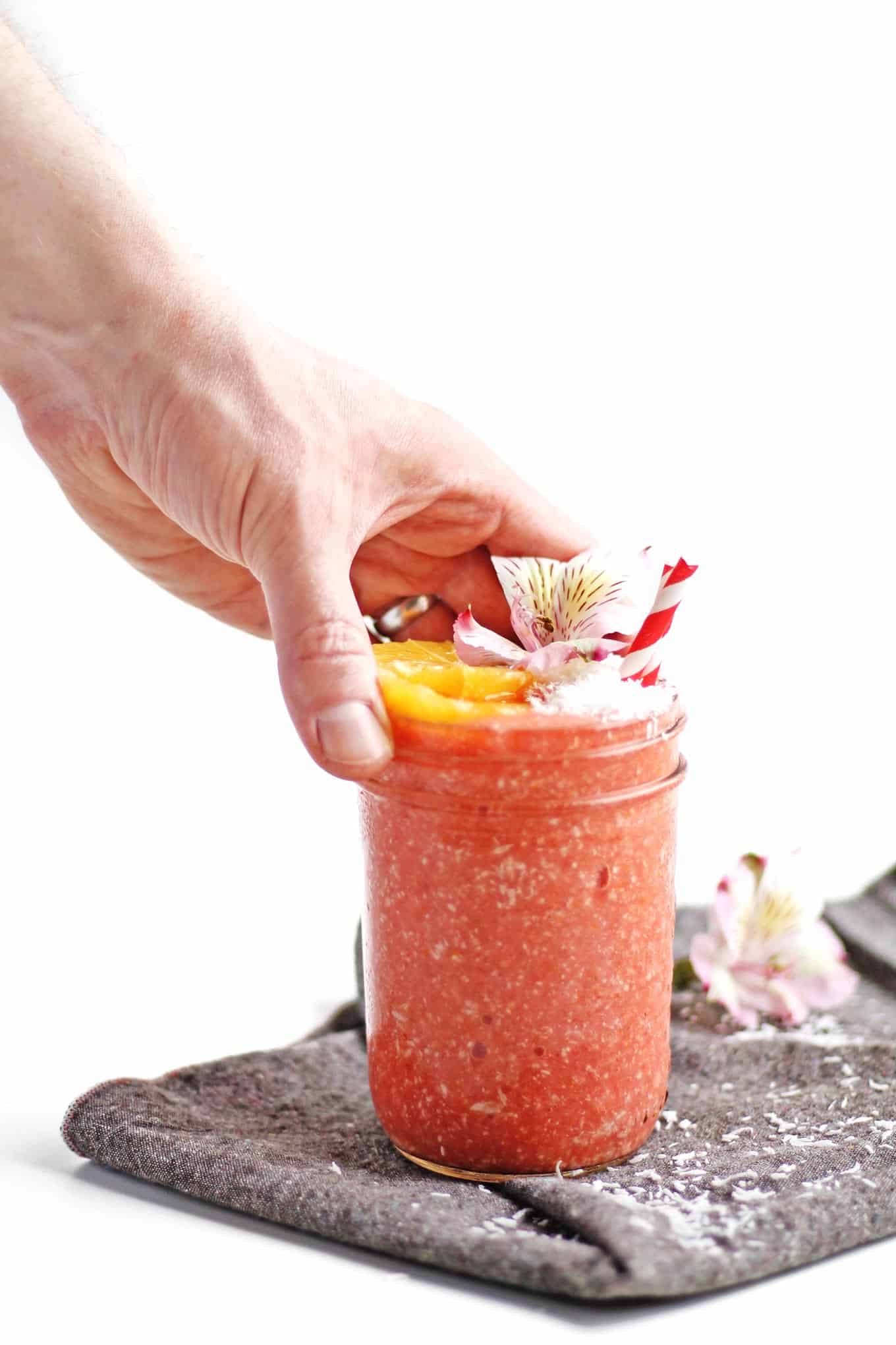 The perfect spring time smoothie! This tropical, refreshing meyer lemon strawberry smoothie with coconut includes an entire meyer lemon. A no waste recipe! Vegan, gluten free, clean eating, sugar free, dairy free, amazing. // Rhubarbarians