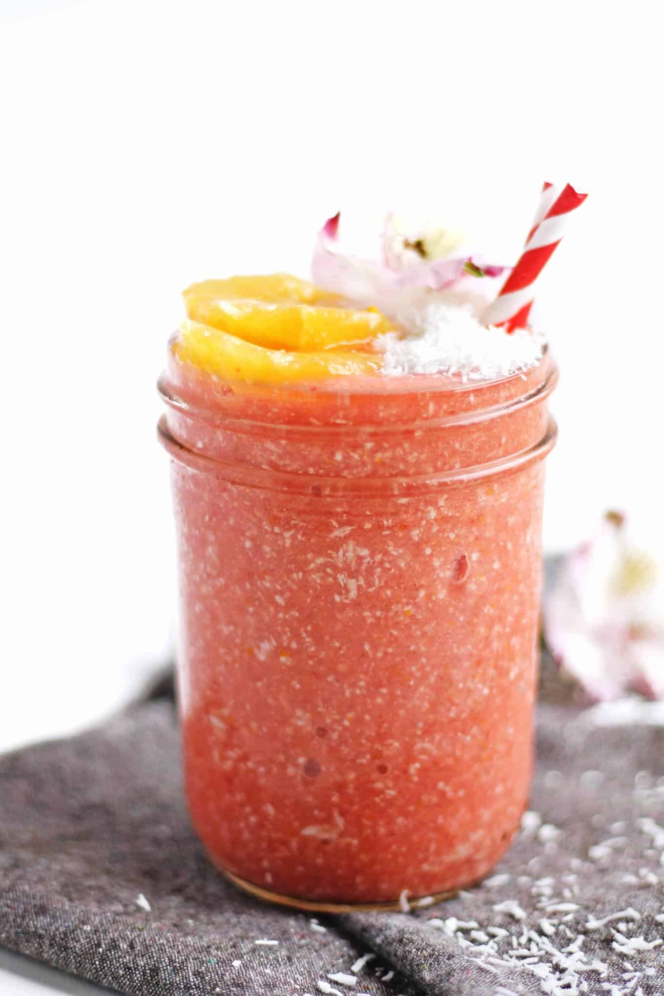 The perfect spring time smoothie! This tropical, refreshing meyer lemon strawberry smoothie with coconut includes an entire meyer lemon. A no waste recipe! Vegan, gluten free, clean eating, sugar free, dairy free, amazing. // Rhubarbarians
