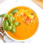 fresh yellow tomato soup with basil