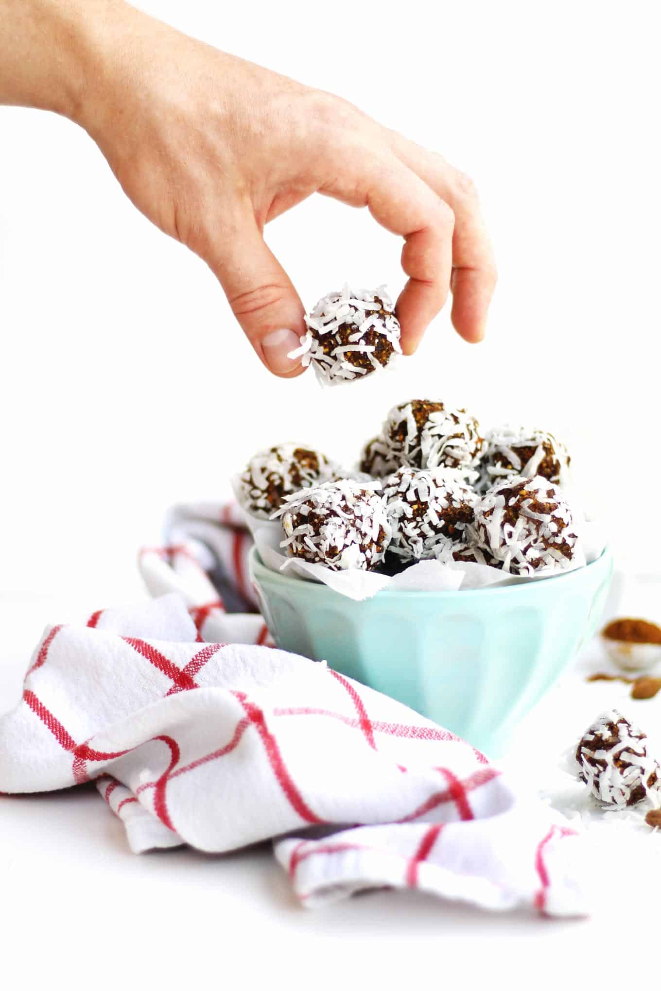 Plum and pistachio coconut bliss balls recipe! These protein packed coconut bites are the perfect quick snack or healthy treat. Vegan and gluten free. // Rhubarbarians
