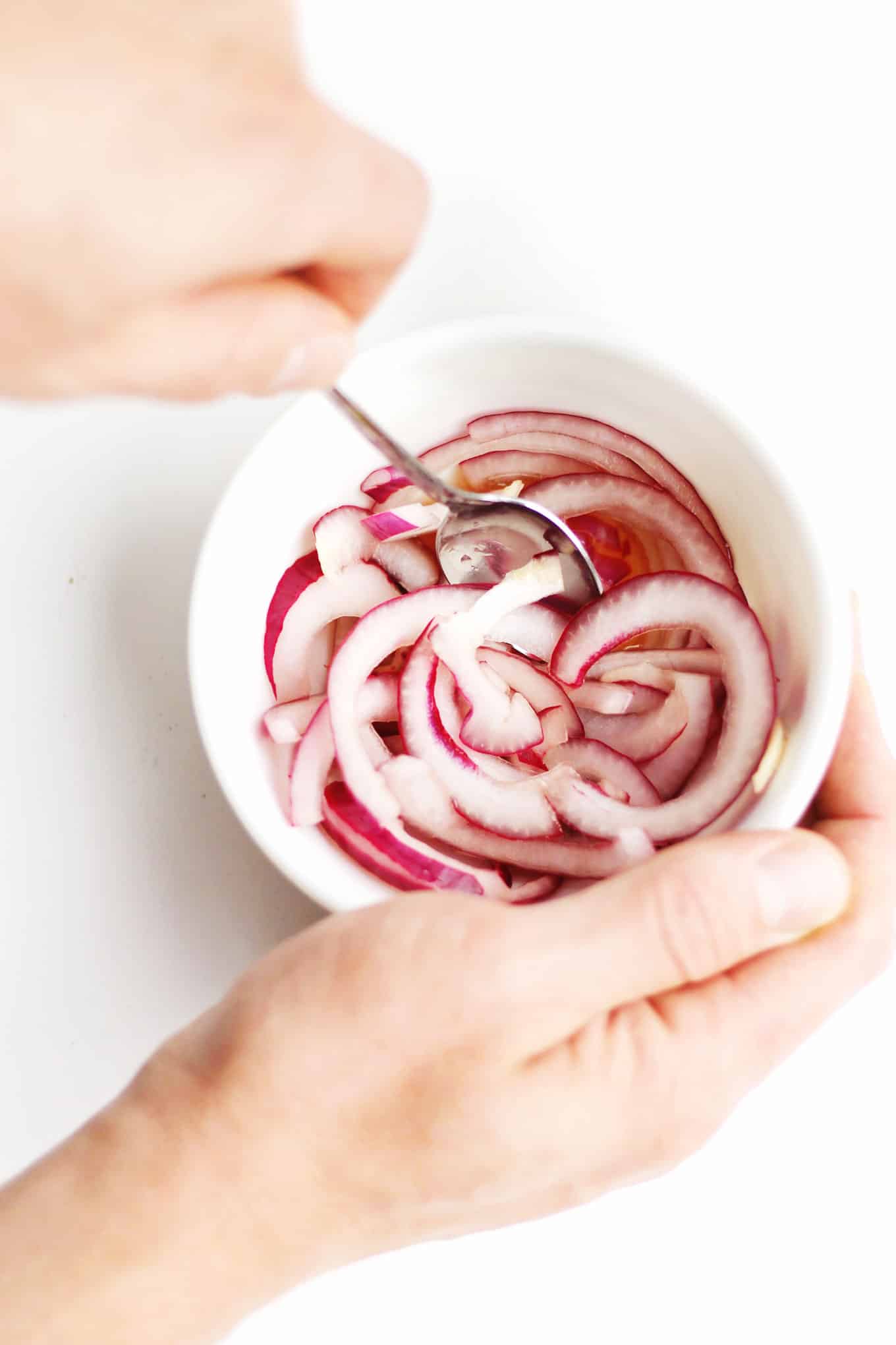 Quick pickled onions photo. 30-minute roasted squash salad with broccoli rabe and kale recipe! A warm, vegan salad perfect for a healthy weeknight dinner or meatless monday. // Rhubarbarians // vegetarian salad / dairy free dinner / gluten free meal / #roastedsquash #meatlessmonday #vegandinner #healthysalad #rhubarbarians #glutenfree