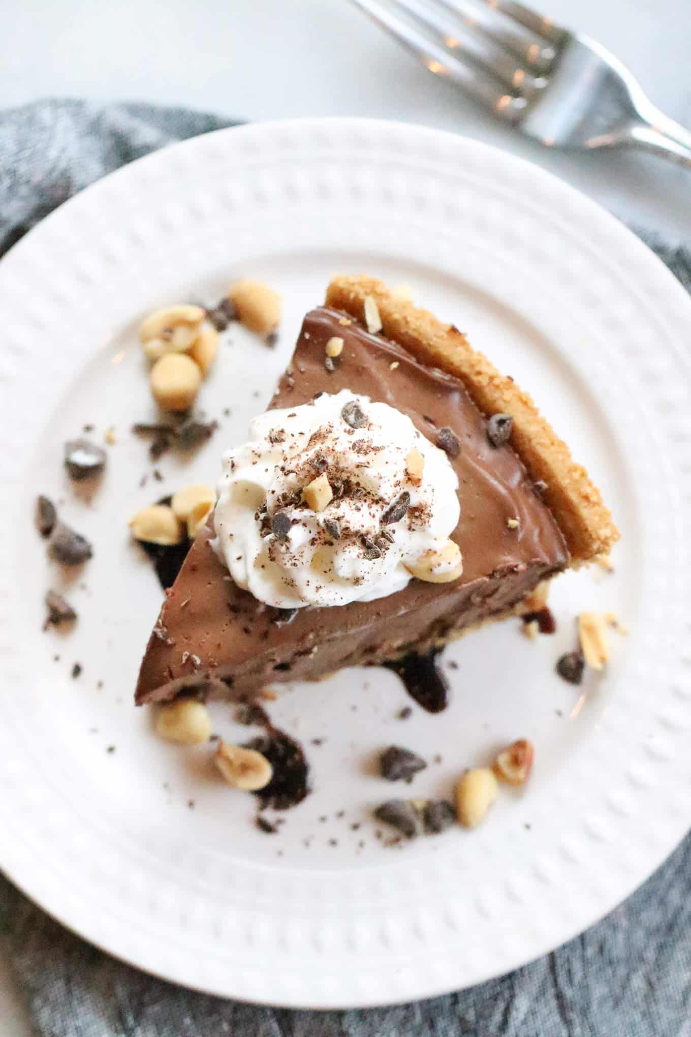 vegan chocolate peanut butter pie on a white plate