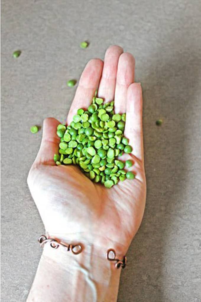green split peas in a hand