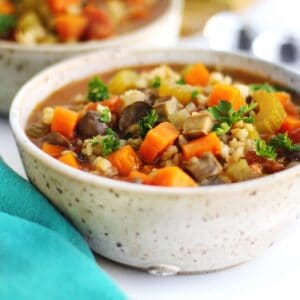 Instant Pot vegetable barley soup in a white bowl