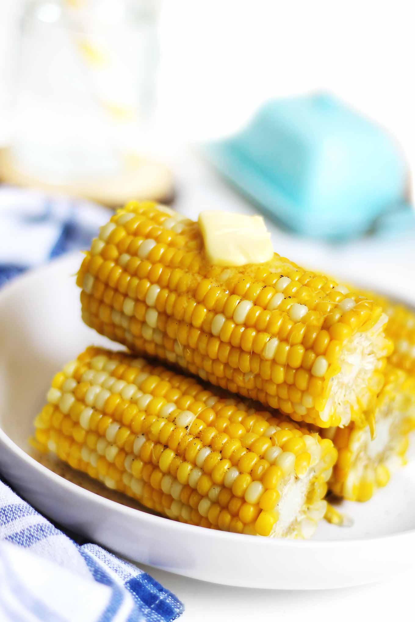 stack corn on the cob with melted butter