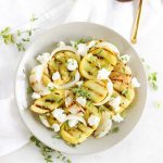 grilled yellow squash in a white bowl