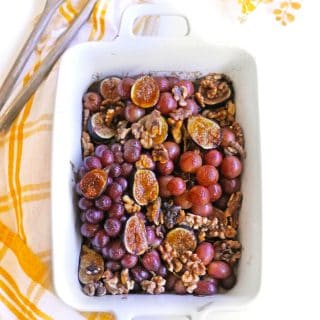 roasted grapes and figs in a white pan