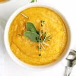 Butternut squash leek soup with herbs on top