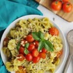 Pesto pasta salad with tomatoes and basil