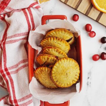 Cranberry orange hand pies in a red pan