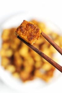 Crispy tofu with chopsticks