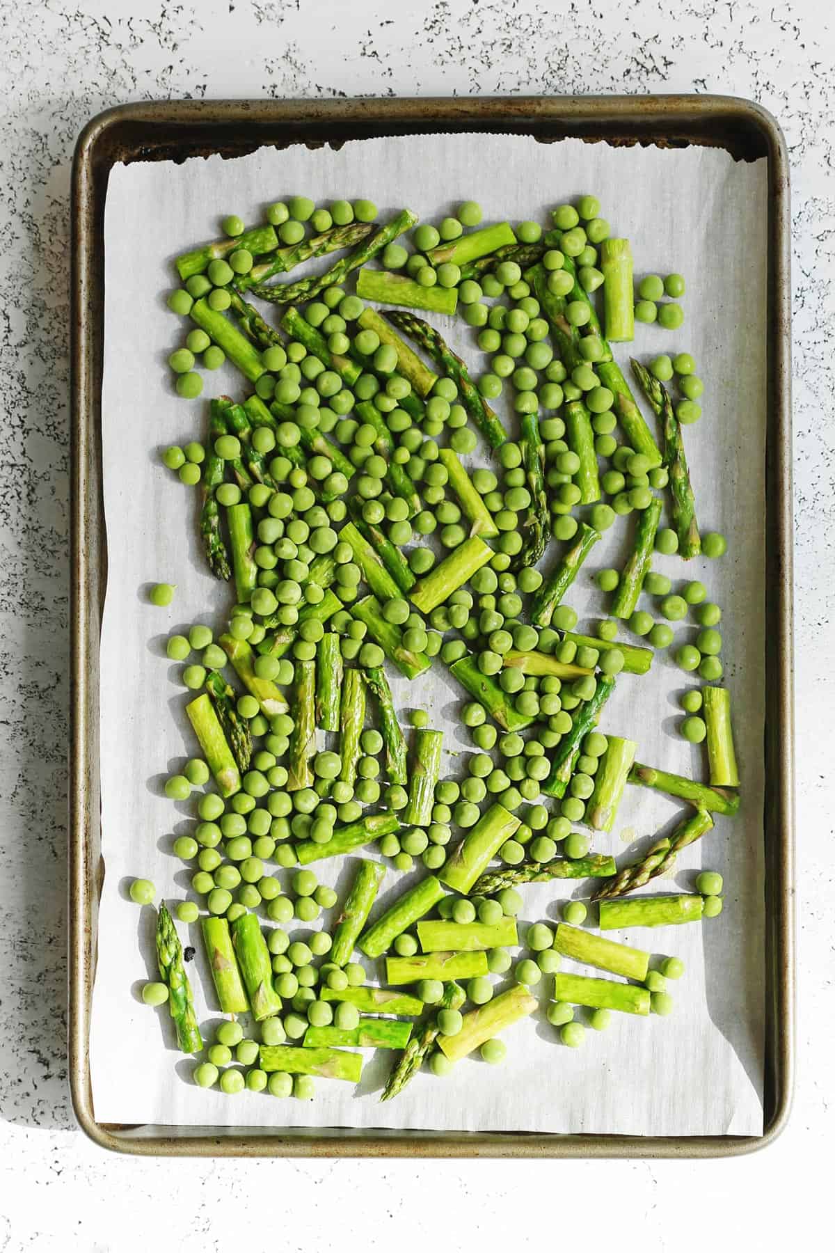 Roasted asparagus and peas on a sheet pan