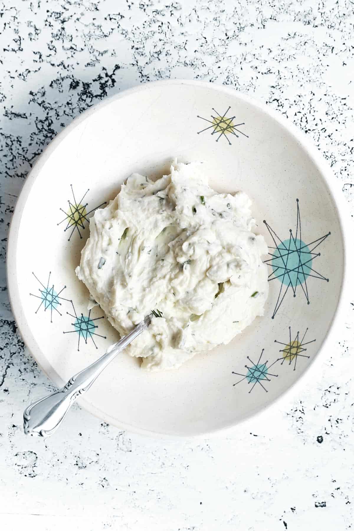 Herbed goat cheese spread in a bowl