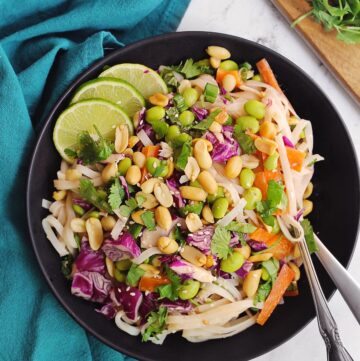 Peanut noodle salad in a black bowl