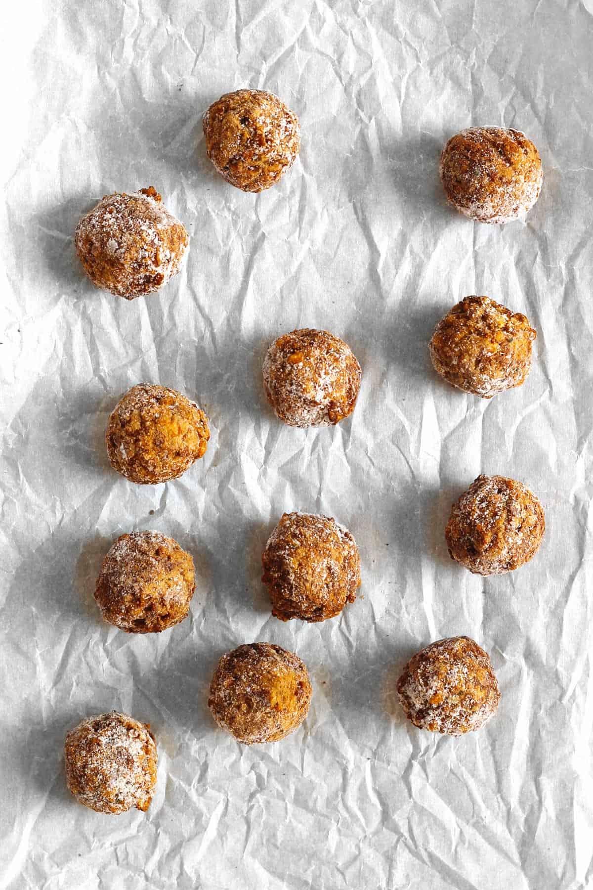 Frozen vegan meatballs on parchment paper