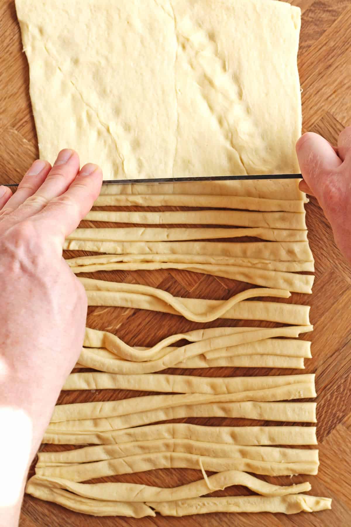 Strips of crescent dough cut with a knife
