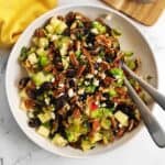 Brussels sprout salad with two serving spoons