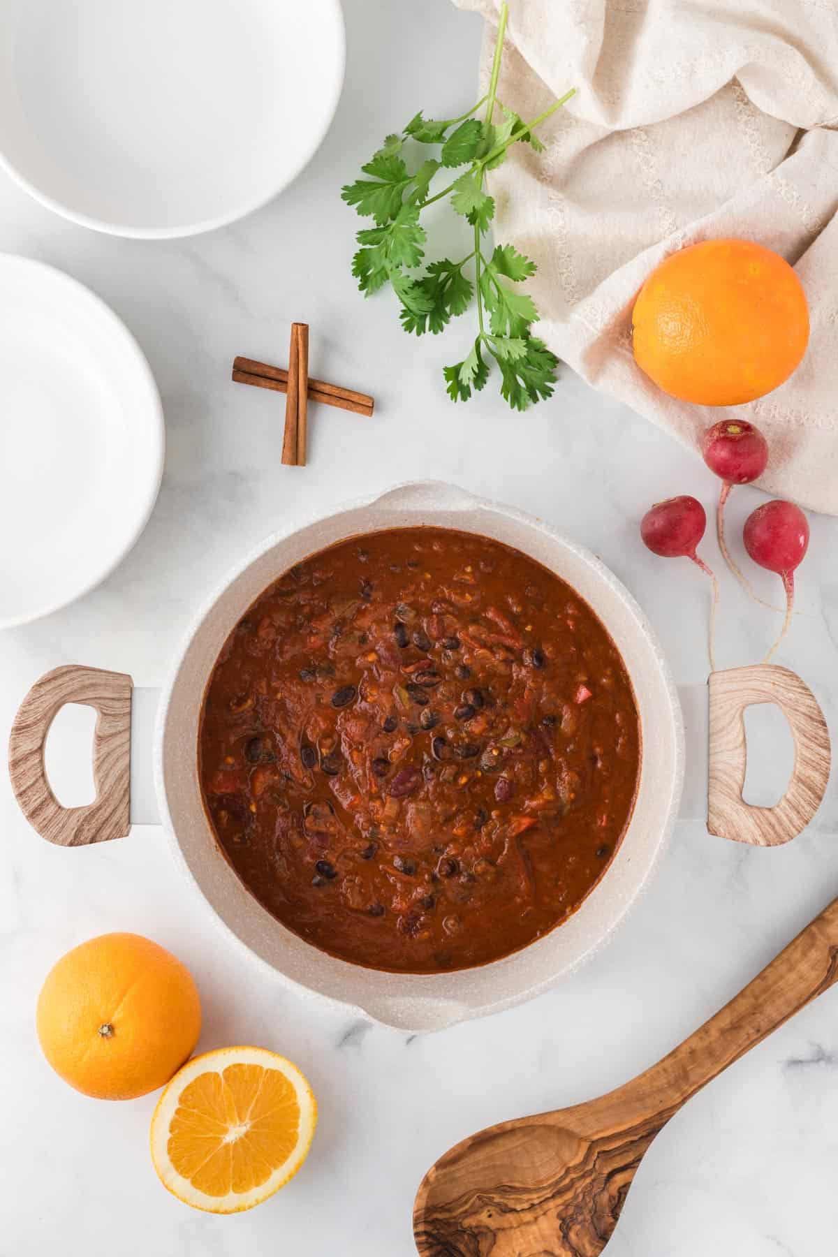 Vegan chili with orange and cinnamon in a pot