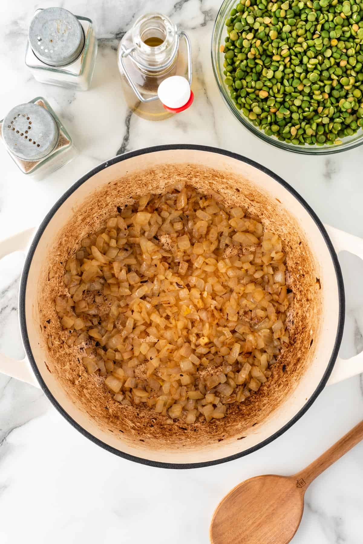A photo of browned onions in a dutch oven.