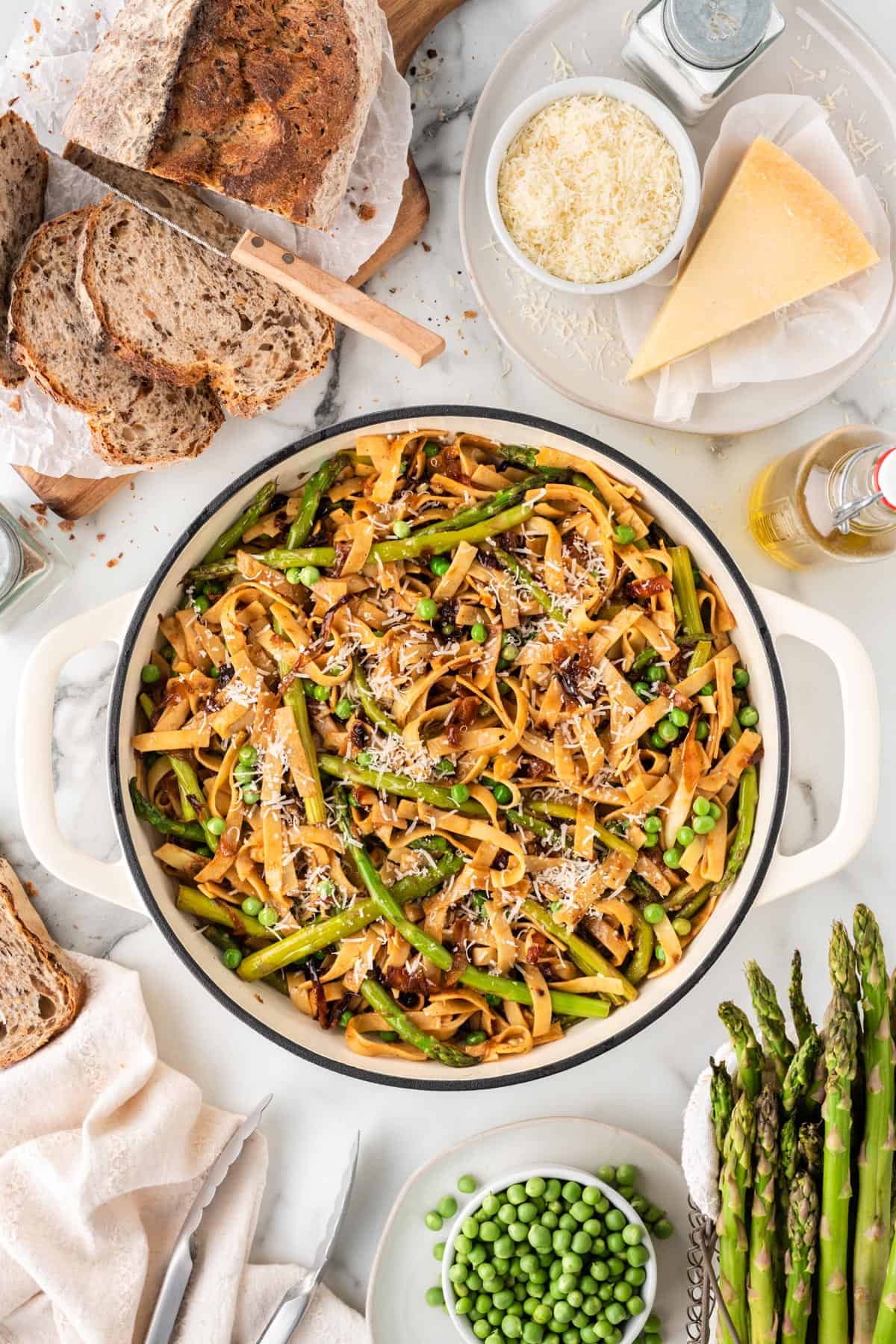 An overhead photo of asparagus pata with peas.