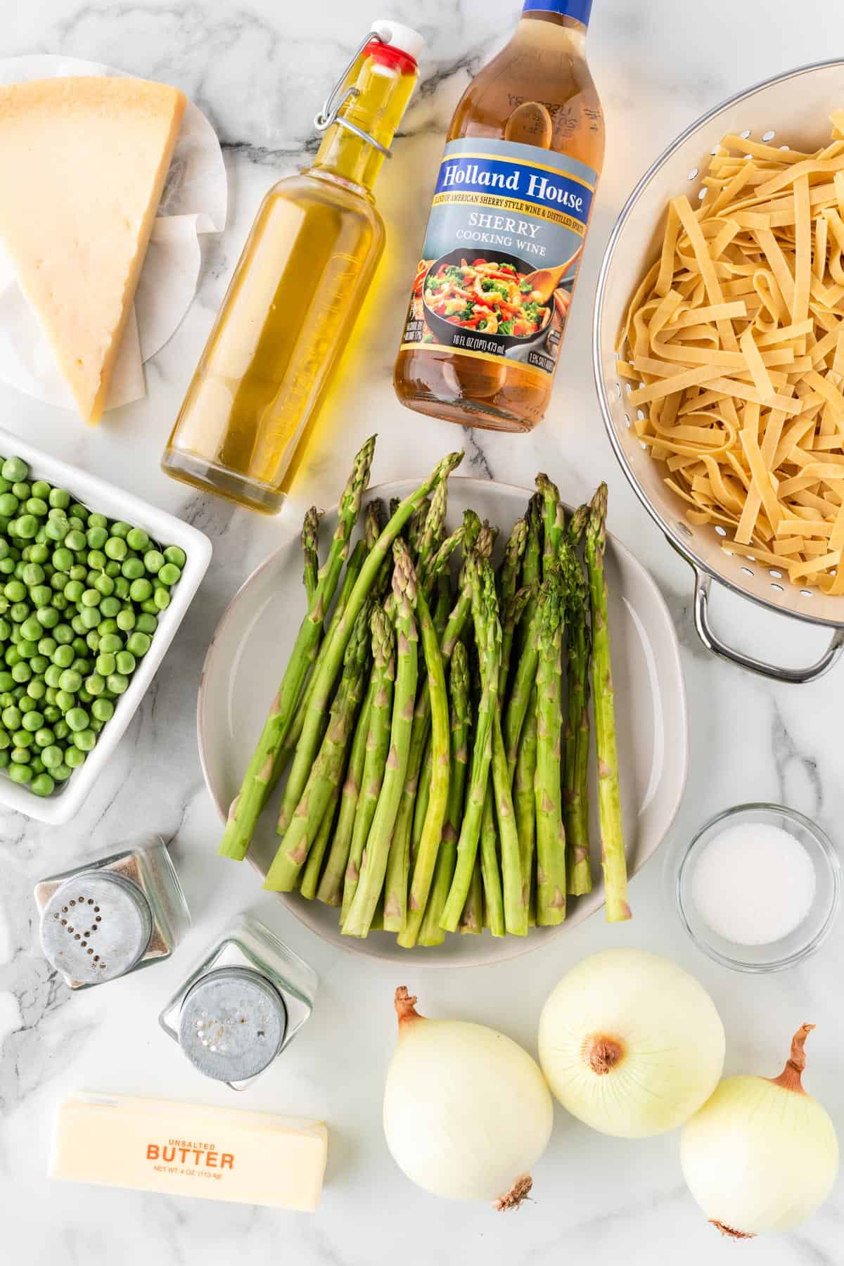A photo of the ingredients needed to make asparagus pasta.