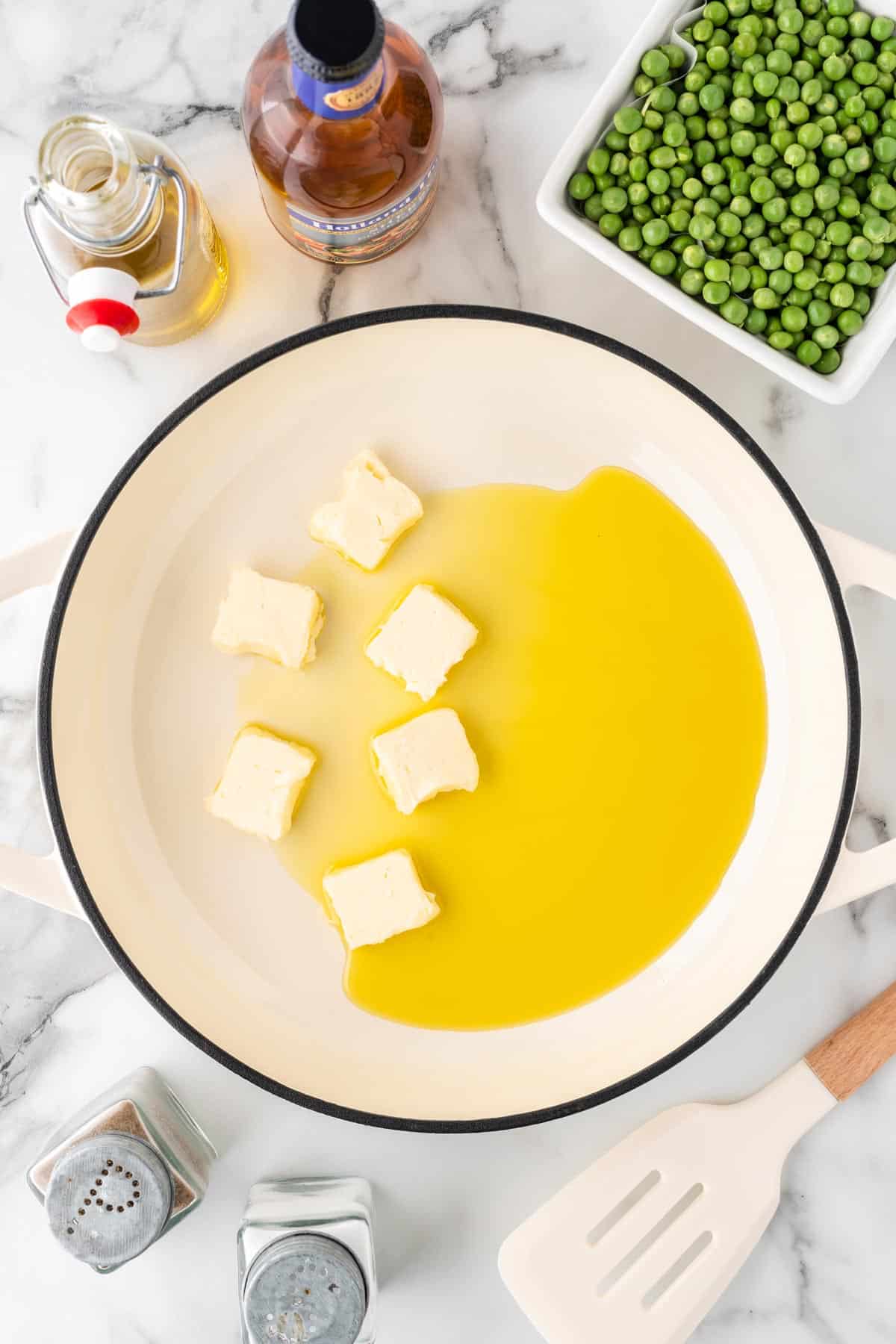 A photo of melting butter and oil in a pot.