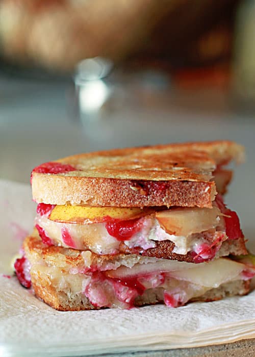 A photo of a cranberry pear and brie grilled cheese stack.